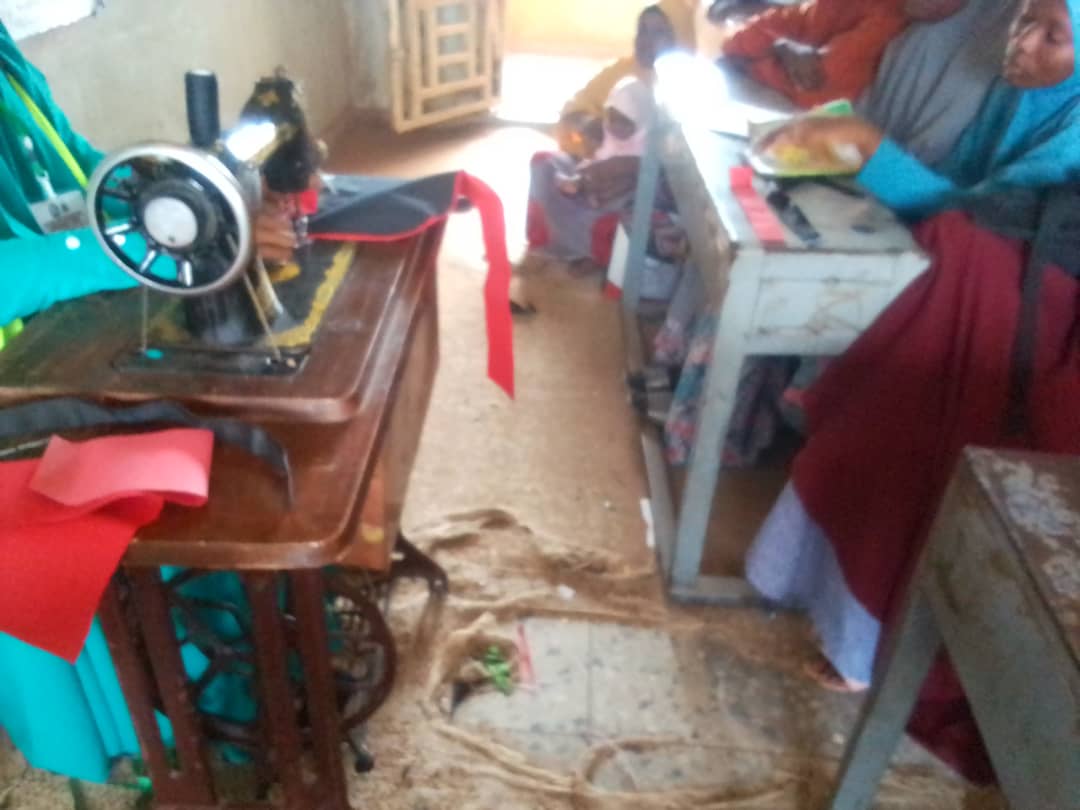 Sewing workshop with women learning tailoring skills