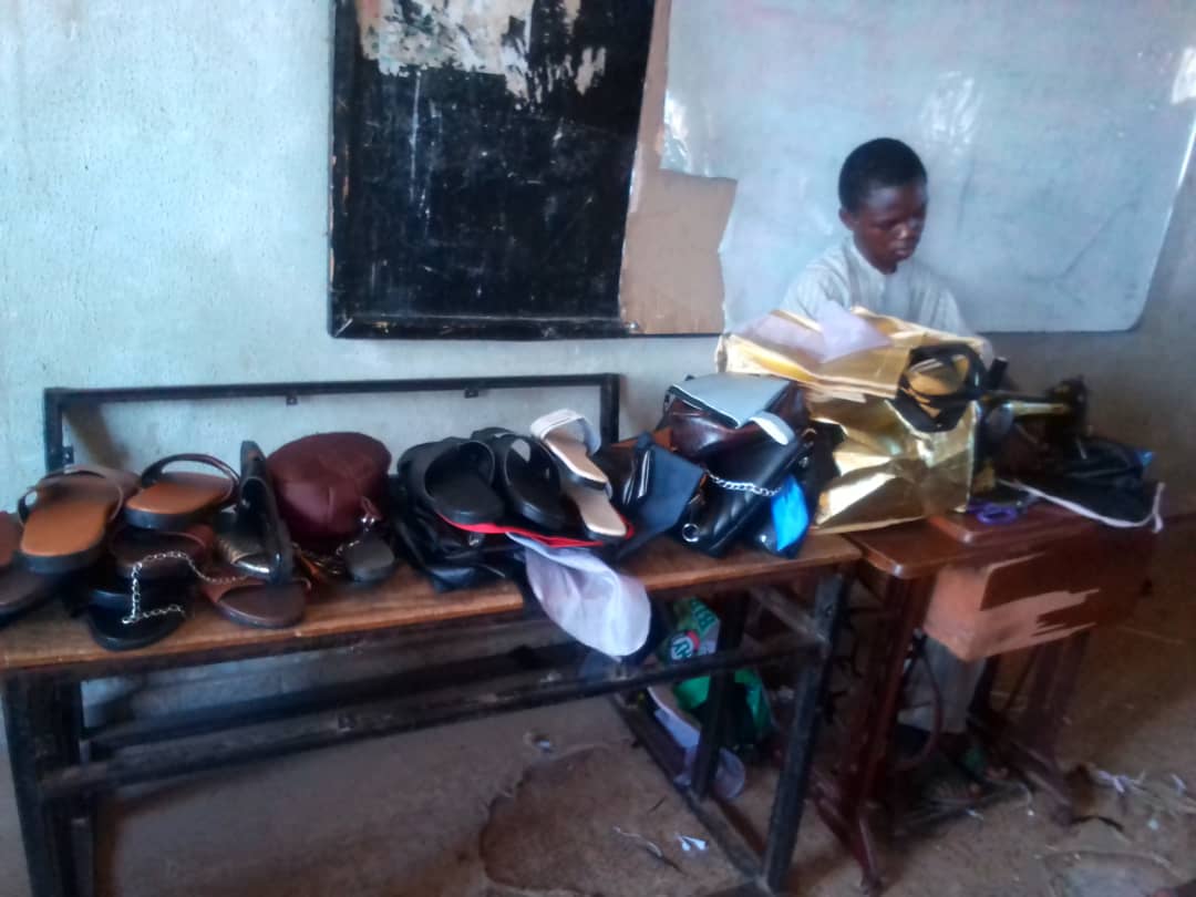 Handmade leather goods including bags and sandals